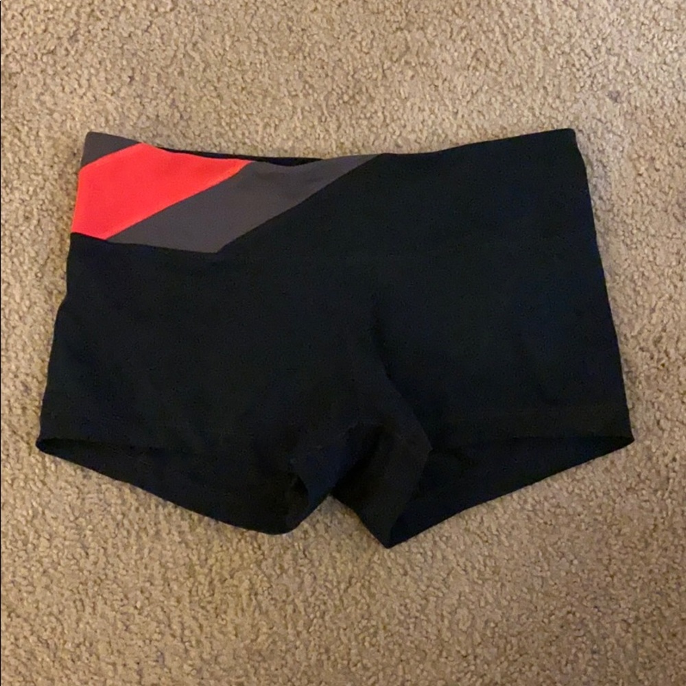 Under Armour Women's Black Athletic Shorts with Red and Gray Accent